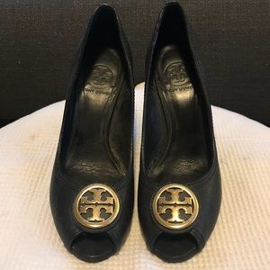 Black Tory Burch wedges with gold logo buckle
